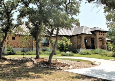 Spring Branch Custom Homes - rock and stucco home with brown metal roof