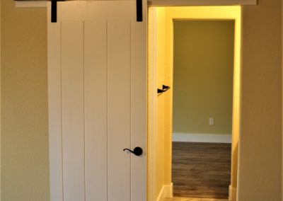 Interior barn door on bathroom