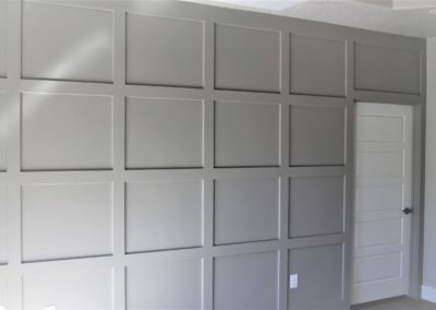 gray coffered accent wall in master bedroom