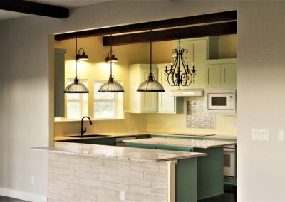 Country Kitchen with pale green cabinets and yellow walls