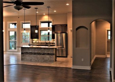 Custom Home Interior with wood and tile floors in Mystic Shores subdivision at Canyon Lake Texas