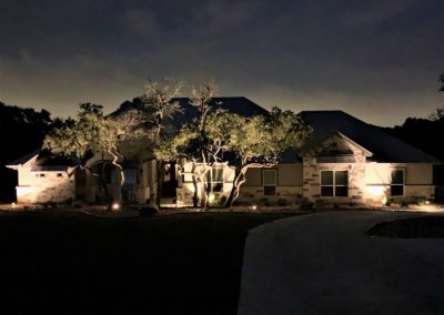 Ramble Ridge Homes. Night time landscape lighting on custom home in Ramble Ridge subdivision in Garden Ridge Texas